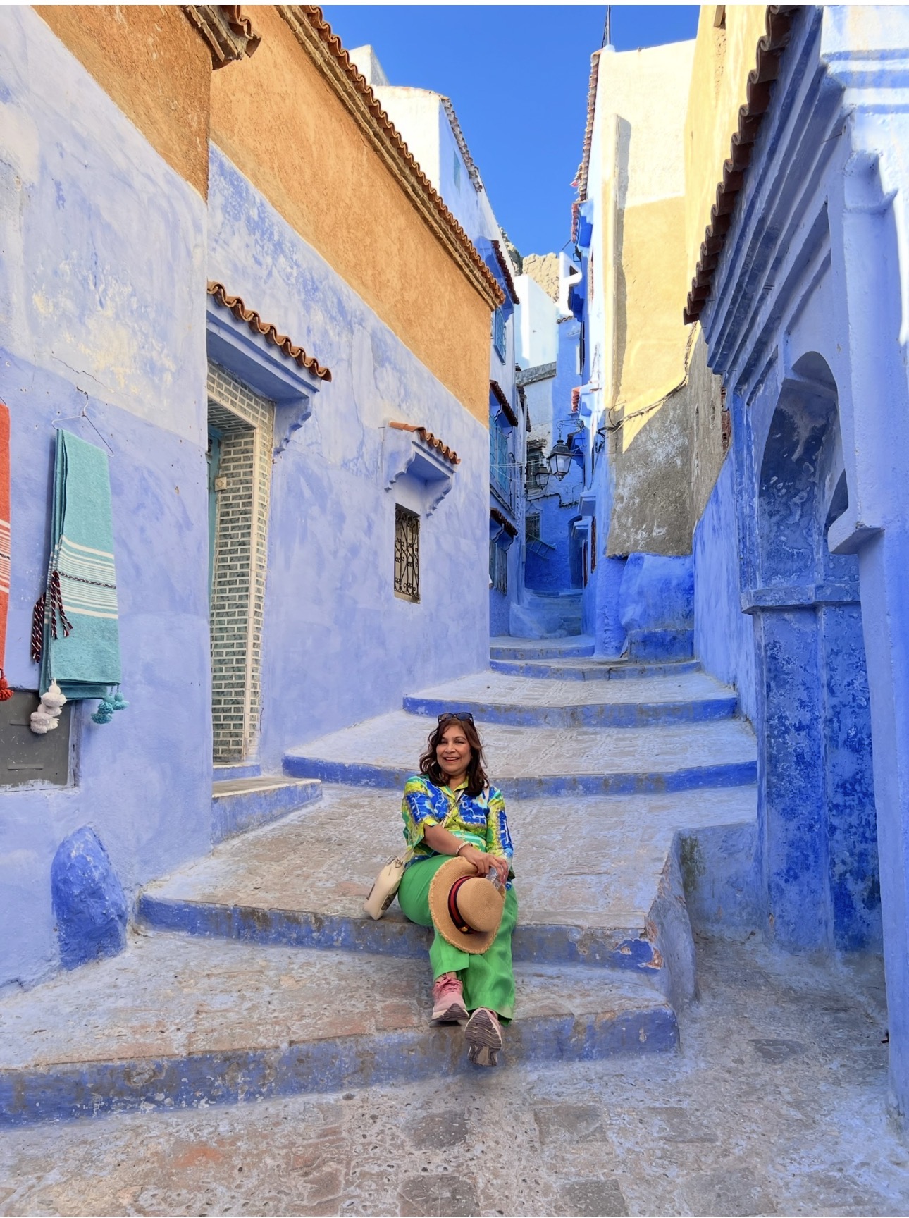 Alka on the blue steps of Chefchaouen
